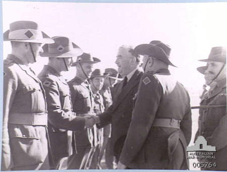 Australian Prime Minister Robert Menzies meets with his country's troops during his 1941 tour of the Middle East [Public domain, Australian National Monument]