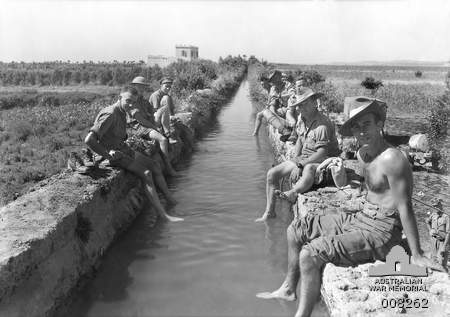 Australian soldiers take a refreshing foot bath in an ancient Roman aqueduct in Syria, June 1941 [Public domain, Australian War Memorial]