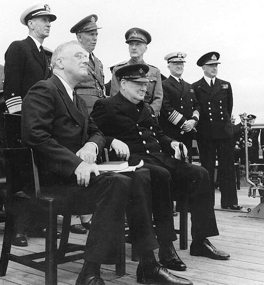 President Roosevelt joins Winston Churchill for a church service on board the Royal Navy battleship HMS Prince of Wales, Newfoundland, August 1941 [Public domain, wiki]