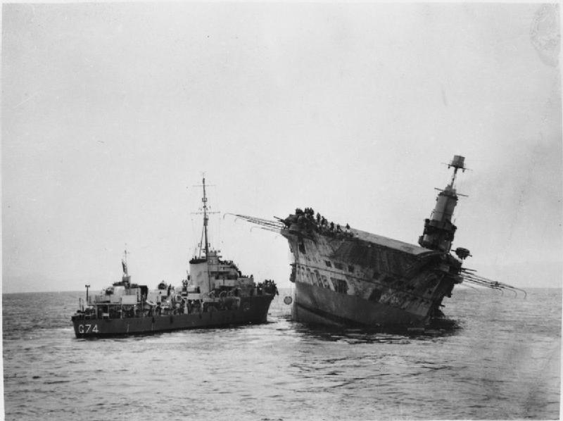 Aircraft carrier HMS Ark Royal, damaged and listing, 13 November 1941. She sank the following day. [Public domain, wiki]