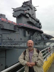 Jeff Williams at the 'USS Lexington Museum on the Bay', Corpus Christi, Texas, USA. The Japanese 'rising sun' flag, high on the superstructure, marks the spot that a Kamikaze plane struck the aircraft carrier on 5 November 1944. [Photograph by Edith-Mary Smith]