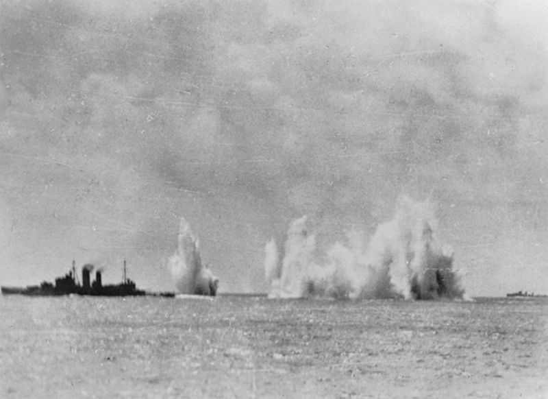 Allied naval squadron under air attack ; Left to right: Cruisers HMS Exeter and HMAS Hobart and a Dutch destroyer, February 1942 [Public domain, wiki/IWM]