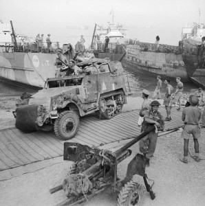 A half-track comes ashore at Reggio during the invasion of Italy, 3 September 1943 [Public domain]