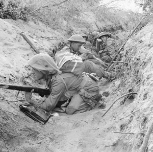 Men of 'D' Company, 1st Battalion, The Green Howards, occupy a captured German communications trench during the offensive at Anzio, 22 May 1944 [Public domain]