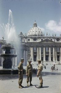 Saint Peter's Square, Rome; two American GIs talk with a British soldier, 1944 [Public domain]