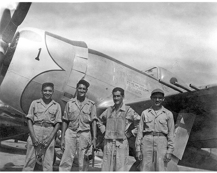 Mexican air force captain, Radames Gaxiola Andrade, stands in front of his P-47D Thunderbolt with his maintenance team after he returned from a combat mission. Captain Andrade was assigned to the Mexican air force's Escuadron 201, which fought in the Pacific. [Public domain, wiki]