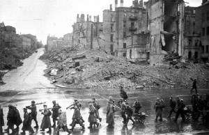 Soviet infantry march along a street in Kiev, November 1943 [Public domain via Wikimedia Commons]